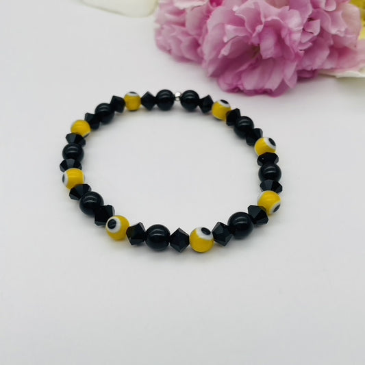 ST1755BL Yellow Eyes and Onyx Bracelet 7"