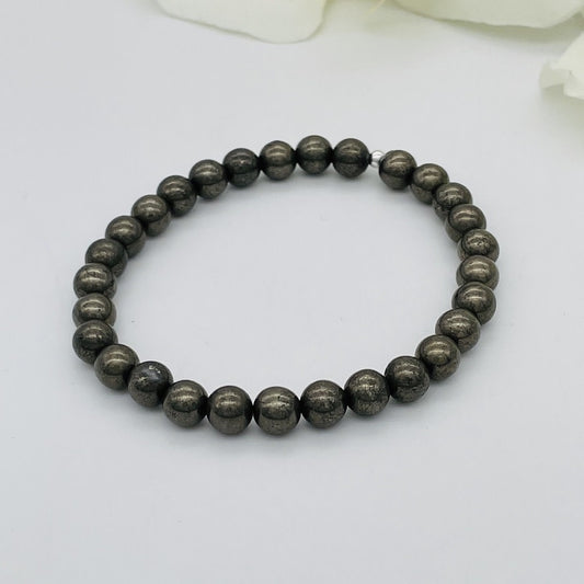 ST1562BL Pyrite Bracelet 6mm. 7"