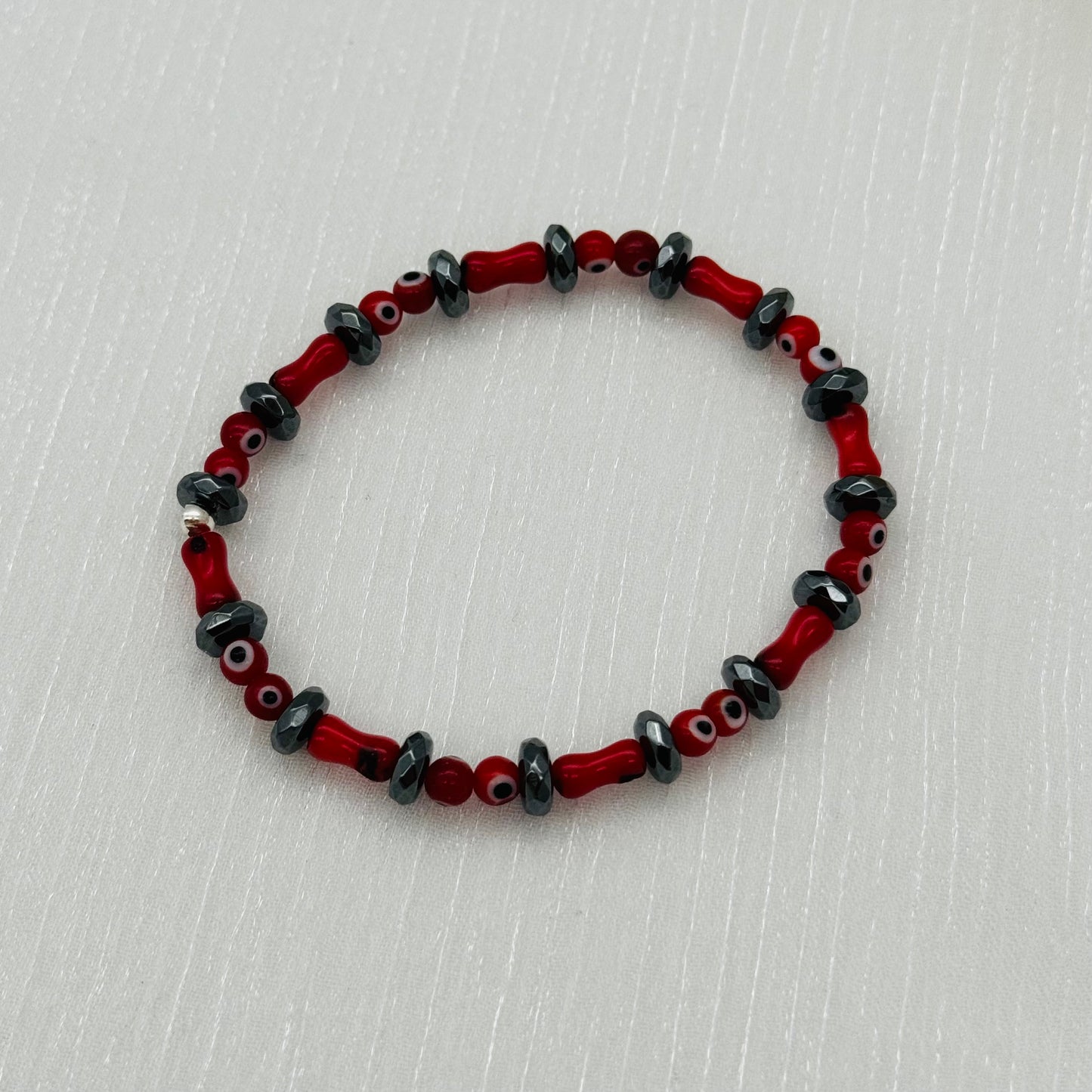 ST1864BL Dyed Red Bamboo Coral With Eyes Bracelet 7"