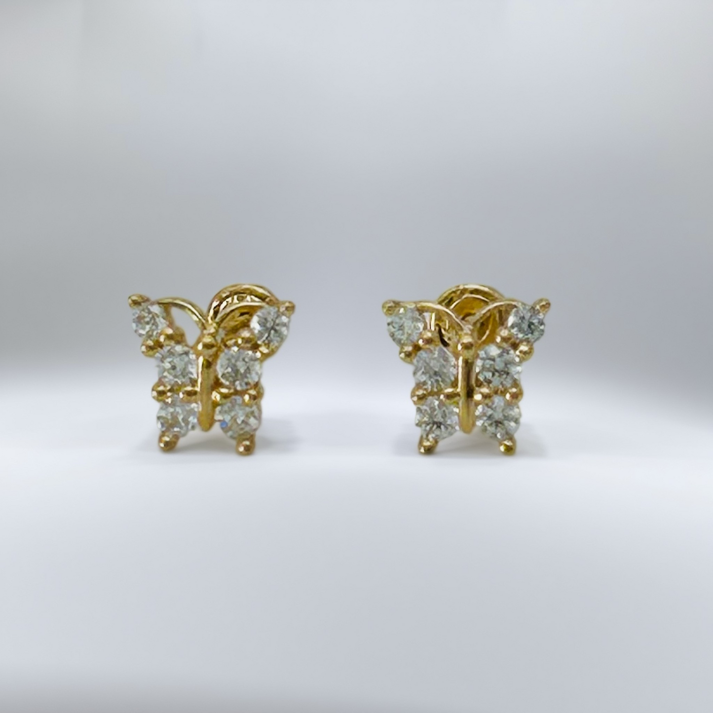 G422 14K Gold Clear Butterfly Earrings 5mm. X 7mm.