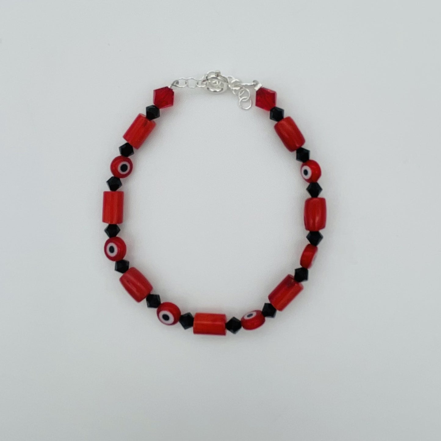 ST1793BL Red Dyed Bamboo Coral With Red Eyes Bracelet 8"