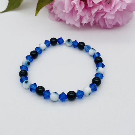 ST1755  Blue Eyes With Onyx Bracelet 7"