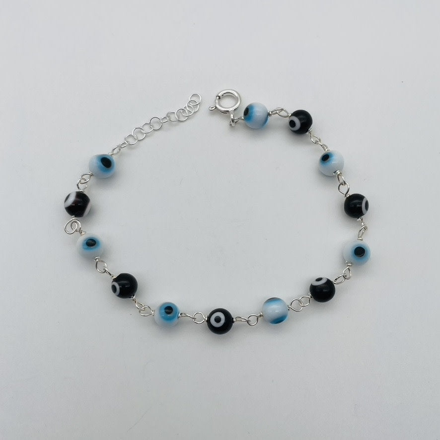 C1336BL White & Black Eyes Bracelet 8"