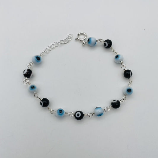 C1336BL White & Black Eyes Bracelet 8"