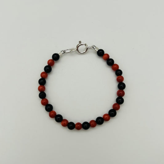 CH941BL Red Dyed Bamboo coral and Onyx Bracelet 4"