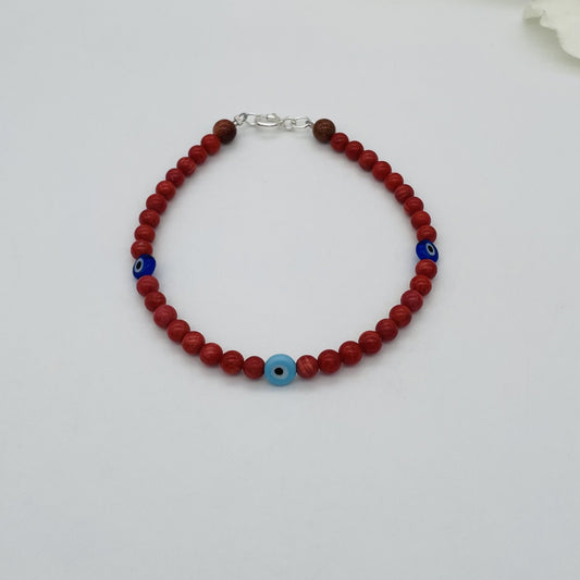 ST1762BL Dyed Red Bamboo Coral & Blue Eyes Bracelet 8"