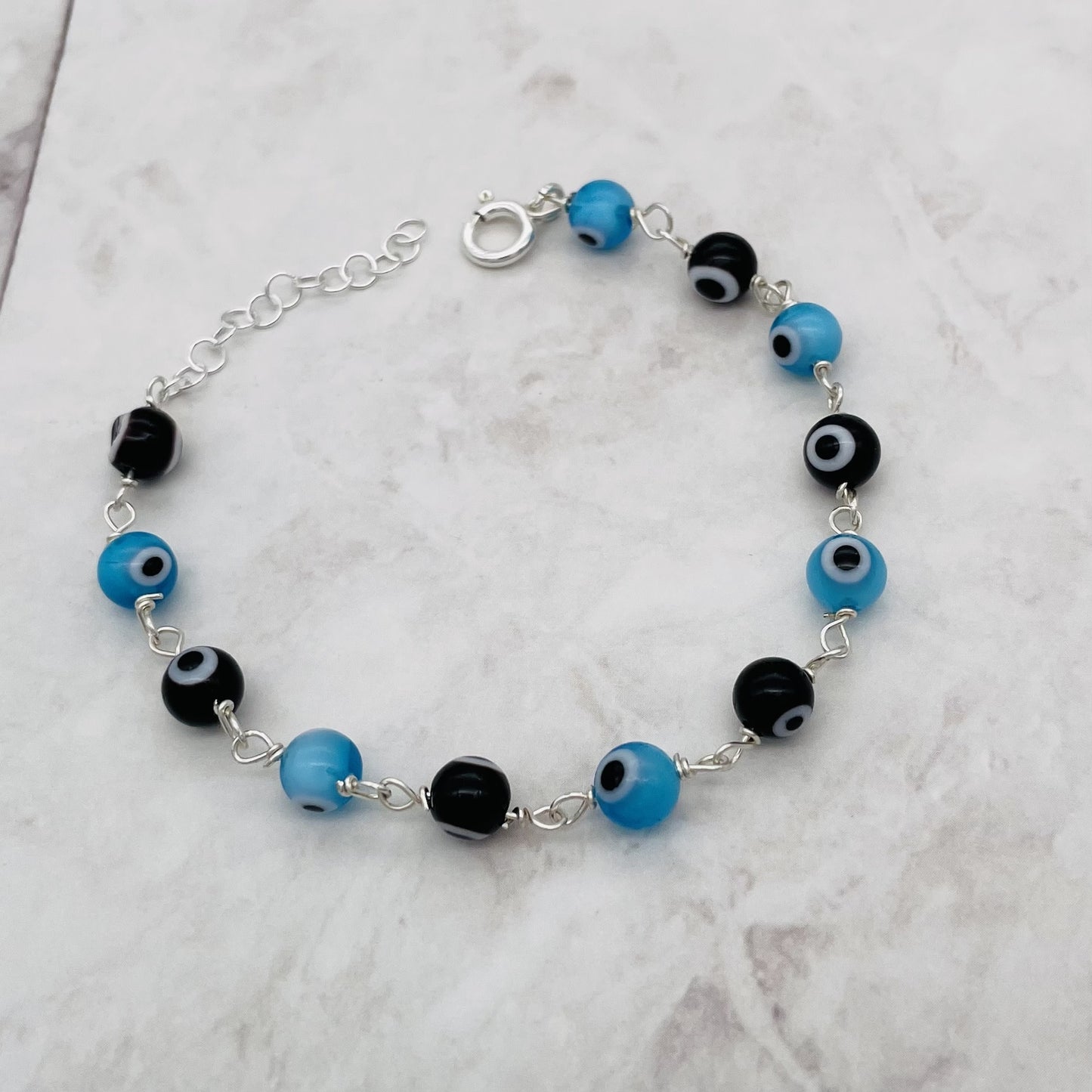 C1336BL Blue & Black Eyes Bracelet  7"