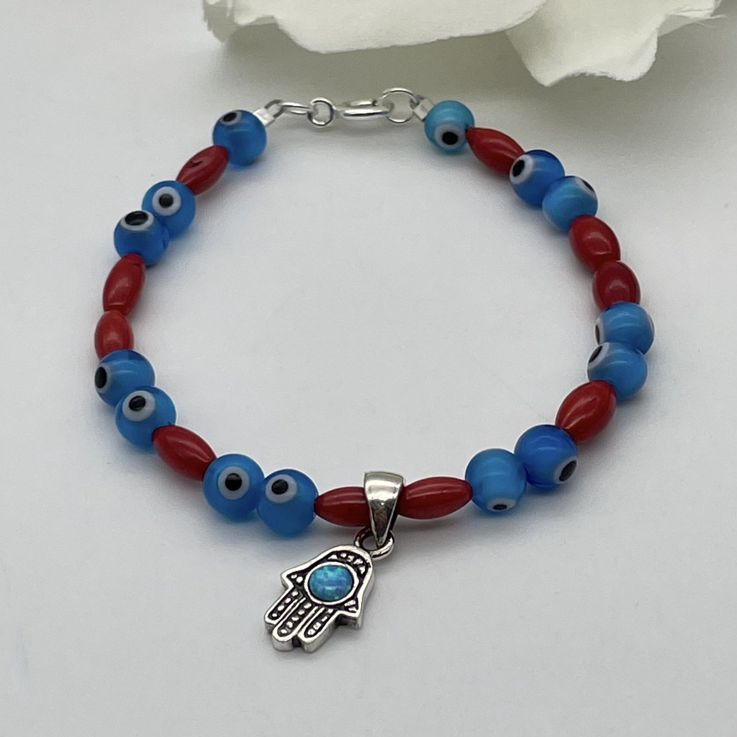 ST1816BL Red Dyed Bamboo Coral With Eyes Bracelet 7"