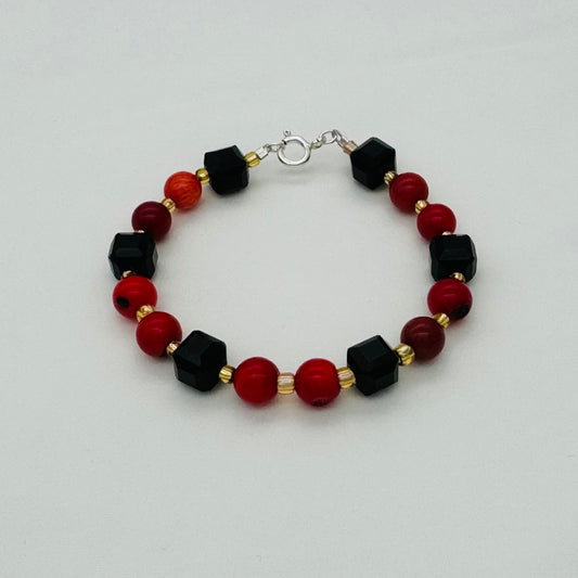 ST1907BL Dyed Red Bamboo Coral & Black Onyx Bracelet 7"